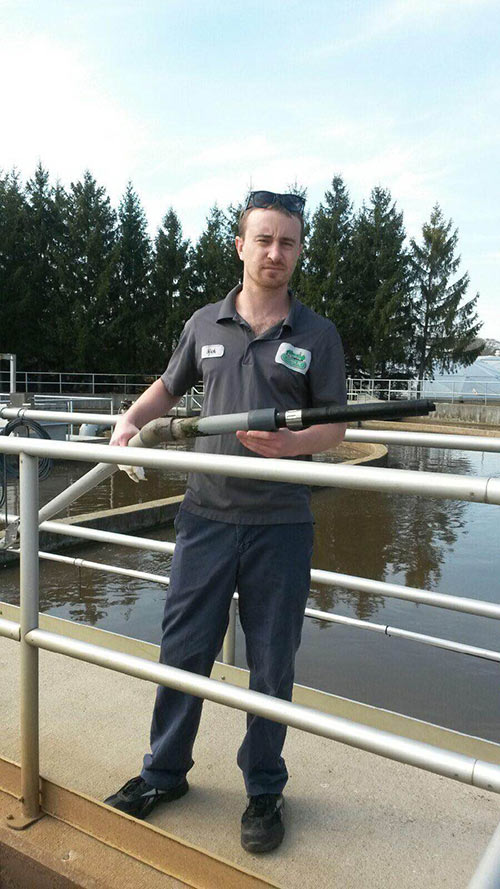 Cedarburg-WWTP-Worker-Holding-FDO-Probe.jpg