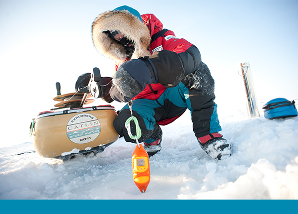 Researchers from the Catlin Survey team deploy a lightweight CTD under Arctic ice to trace effects of melting ice and warmer temperatures. 