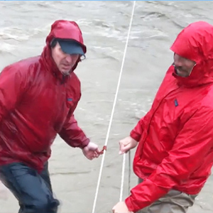 hydrologist measure velocity discharge flood water